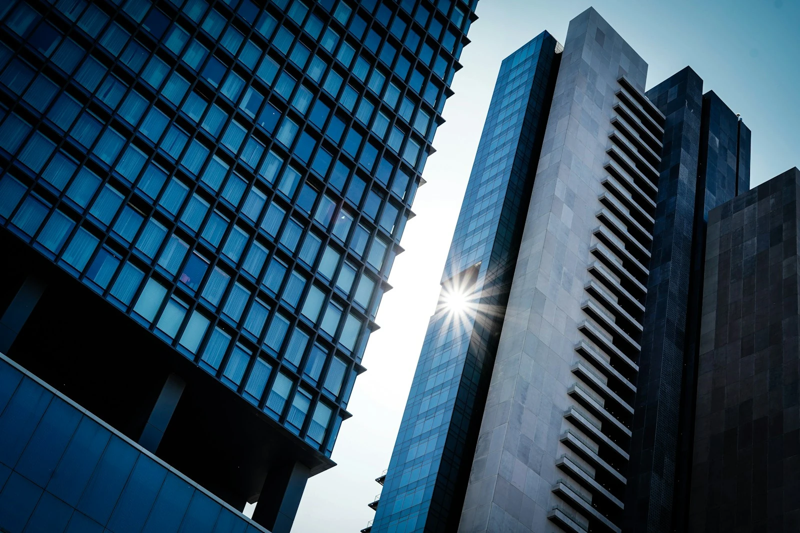 Contemporary architecture reaching toward a clear blue sky